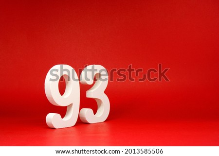 Ninety Three ( 93 ) white number wooden on Red Background with Copy Space - New promotion 93% Percentage , Birthday anniversary , Business finance Concept 