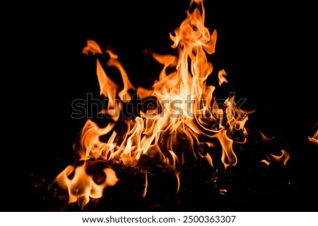 Similar – Image, Stock Photo The flame of a candle is blown aside by the wind in the darkness