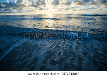 Similar – Image, Stock Photo Scenic seascape with sandy shore and rocky cliffs against night sky