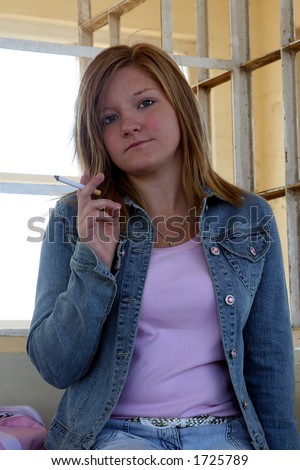 Similar – Foto Bild Teenager-Mädchen mit Rauchzeichen am Strand