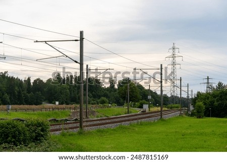 Similar – Image, Stock Photo Street, meadow with distribution box, facades of single-family houses, small town