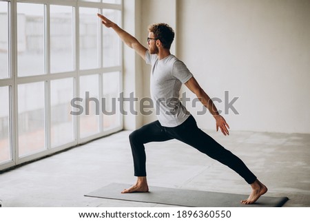 Similar – Image, Stock Photo Flexible young yogi man standing on beach