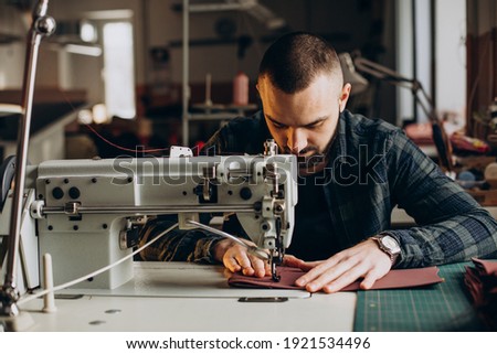 Male designer and leather tailor working at a factory Foto stock © 