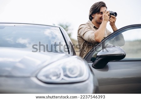 Similar – Image, Stock Photo Casual tourist making photo on smartphone of nature