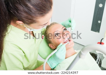 Drilling procedure made by a female dentist