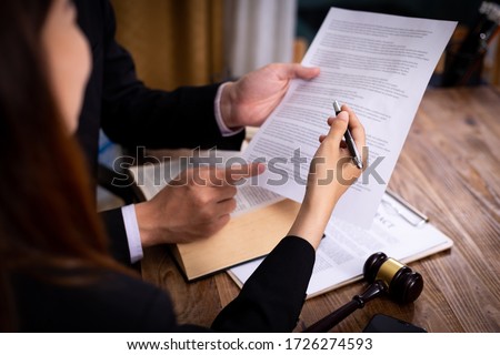 Mediation client meeting lawyer consulting government help, Businessman and Male lawyer or judge consult having team meeting with client, Law and Legal services concept.