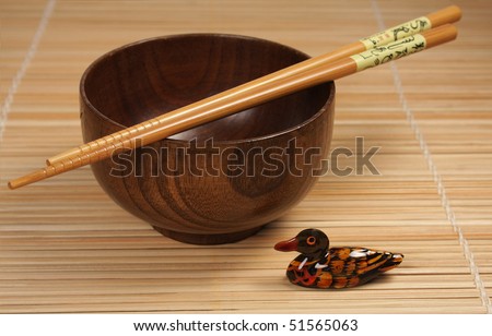 bowl with chopsticks and ornamental  duck