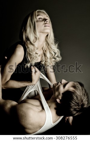 handsome sexy guy with pretty woman,  sex, on dark background,