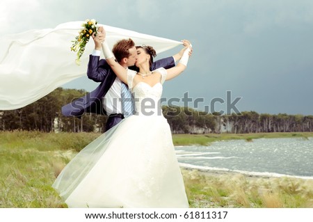 cutie happy married  couple  on nature, puff wind, hot kiss