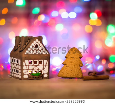 fairy Christmas house cake with candle light inside, narrow depth of field and background lights
