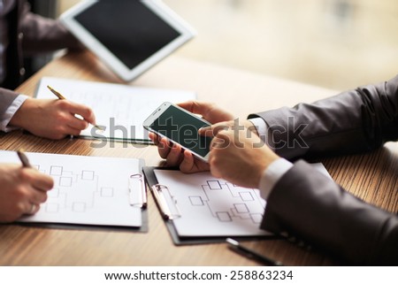Business team working on a scheme business using the tablet and smartphone