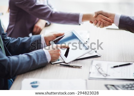 A group of businessmen discussing the policy of the company in the office.