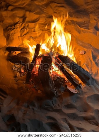 Similar – Image, Stock Photo Flames leap up, the heat distorts the view on the tree in the background