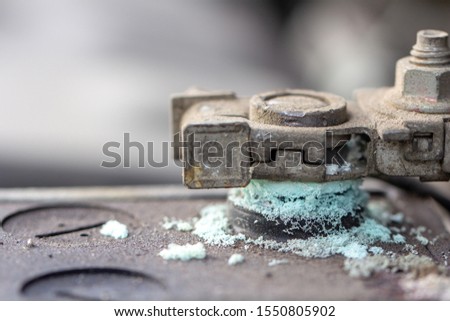 Mechanic checking car Battery terminal in a garage .Old battery corrosion deteriorate leaking with blue acid powder.Battery terminals corrode dirty damaged problem. Stock foto © 