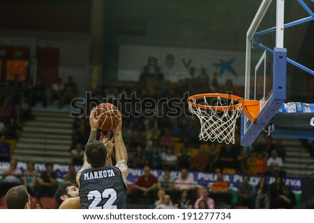 VALENCIA - MAY, 3: Markota #22 gets rebound during a Spanish league match between Valencia Basket Club and Bilbao at the Fonteta Stadium on May 3, 2014 in Valencia, Spain
