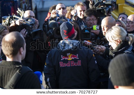 VALENCIA, SPAIN - FEBRUARY 1: F1 Winter Test - Sebastian Vettel with press - on February 1, 2011 in Cheste, Valencia, Spain