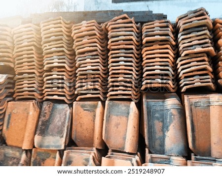 Similar – Image, Stock Photo Red-brown curved roof tiles on the roof of an old building with chimney in the sunshine in Oerlinghausen near Bielefeld on the Hermannsweg in the Teutoburg Forest in East Westphalia-Lippe