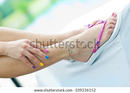 woman feet in summer flip flops