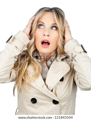 attractive blond woman making surprised facial expression isolated