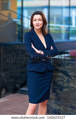 attractive businesswoman outside the office building