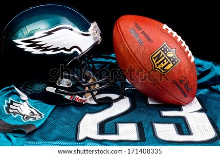 ZAGREB , CROATIA - JANUARY 15 ,2014 :   official american football NFL equipment , ball , helmet and jersey by Philadelphia Eagles club, product shot