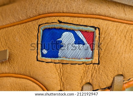 ZAGREB , CROATIA - AUGUST 19 , 2014 :  MLB logo on baseball leather glove close up , product shot