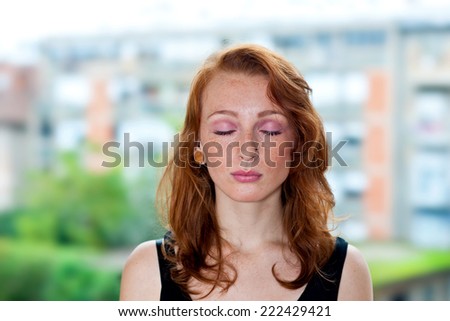 attractive red hair freckled woman portrait outside
