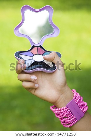woman hand with makeup box
