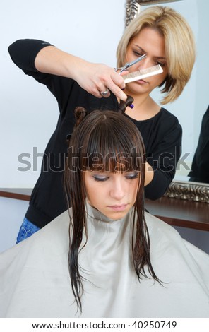 woman with wet hair in hair salon having treatment