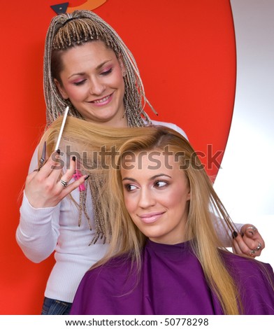 hair stylist work on woman in salon