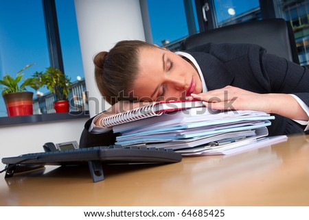 business woman sleeping at office desk