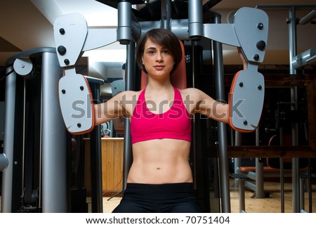 woman workout on machine in the gym