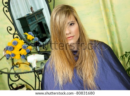 woman in hair salon with messy hair waiting for haircut