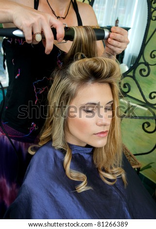 beautiful woman with messy hair waiting in hair salon