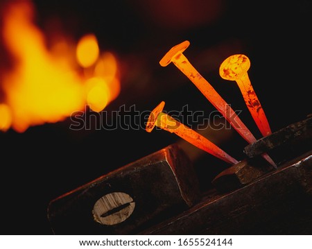 Similar – Image, Stock Photo Close-up hot metal nail on an anvil in blacksmith’s workshop