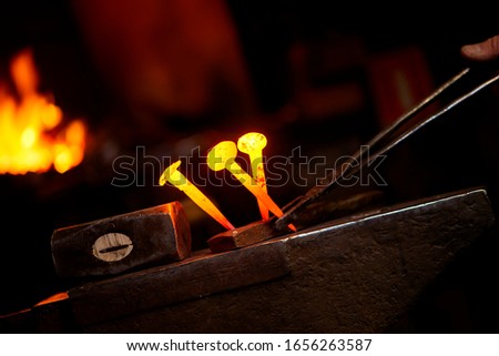 Similar – Image, Stock Photo Close-up hot metal nail on an anvil in blacksmith’s workshop