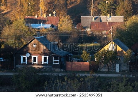 Similar – Foto Bild Kleiner Fluss in einem lettischen Wald, aufgenommen von einer Brücke. Das Wasser ist mit Wasserpflanzen bewachsen, viele Grüntöne und einige Gelbtöne. Frühherbst Landschaft, bewölkten grauen Himmel