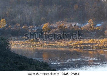 Similar – Foto Bild Kleiner Fluss in einem lettischen Wald, aufgenommen von einer Brücke. Das Wasser ist mit Wasserpflanzen bewachsen, viele Grüntöne und einige Gelbtöne. Frühherbst Landschaft, bewölkten grauen Himmel