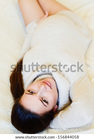 pretty pregnant woman laying on the sofa