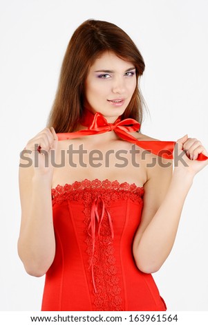 teen girl wearing red dress with bow on neck