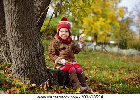 cute and fashion toddler girl in fall time