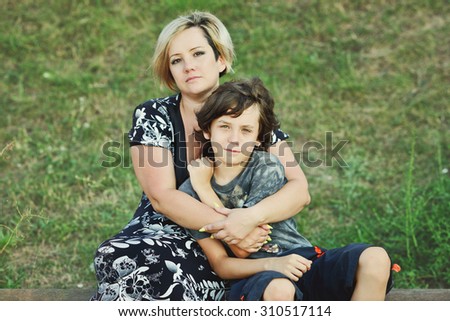 middle age woman and her son outdoors