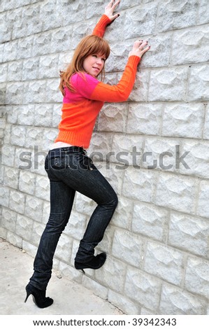 fashion girl wanting to climb the wall