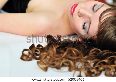 beautiful girl sleeping after party, she even has a make-up