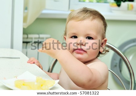 dirty mouth of little baby girl on the kitchen