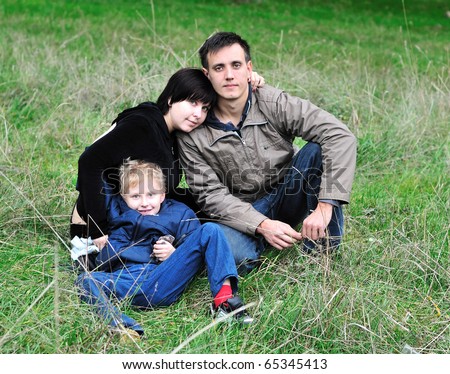 happy loving family in the forest during early autumn