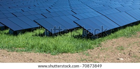 Field with black solar panels.