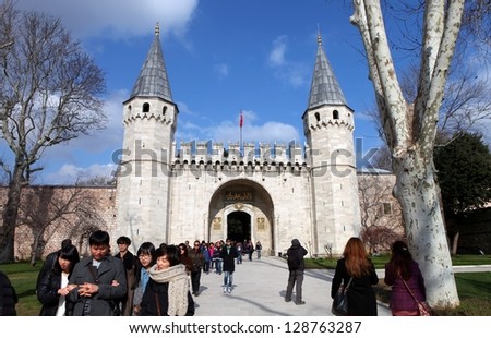 ISTANBUL,TURKEY- FEBRUARY 18 :Tourists go through Gate of Felicity, the entrance into the Inner Court also known as the Third Courtyard in the Topkapi Palace on February 18, 2013 in Istanbul,Turkey