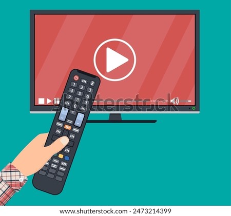 Hand holding remote control. TV icon concept. Play icon on television. Smart TV concept