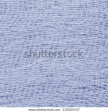 White medical bandage gauze texture, abstract textured background macro closeup, natural cotton linen fabric, copy space in blue